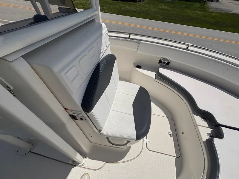 Slide: The Image of 2019 Robalo R222 Center Console boat interior with seating and storage. - 7