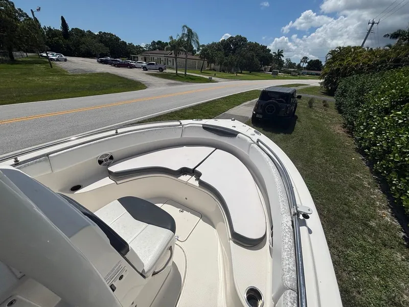 Slide: The Image of 2019 Robalo R222 Center Console boat parked on grassy roadside. - 9