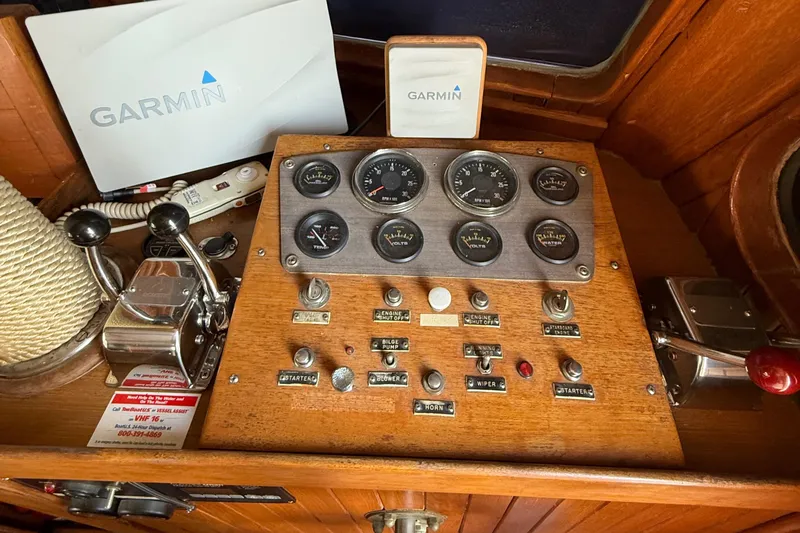 Slide: The Image of Control panel of a 1978 DeFever 39 boat with Garmin navigation equipment. - 10