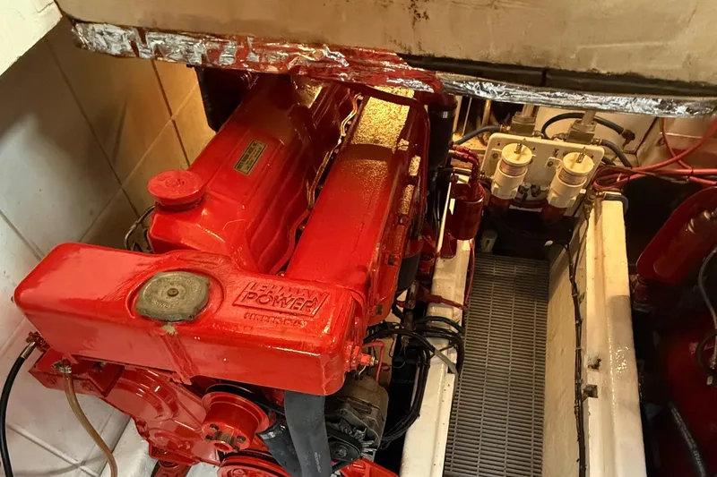 Slide: The Image of Engine room of a 1978 DeFever 39 boat with a red Lehman Power engine. - 4