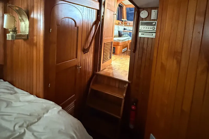 Slide: The Image of Interior of 1978 DeFever 39 yacht with wooden paneling and cozy cabin space. - 6