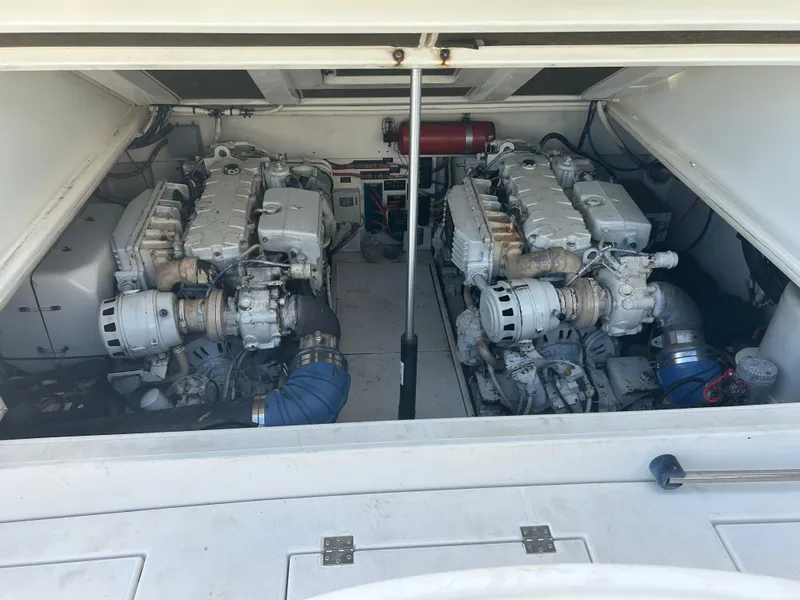 Slide: The Image of Engine compartment of a 2006 Rampage EXPRESS boat, featuring dual engines and mechanical components. - 24