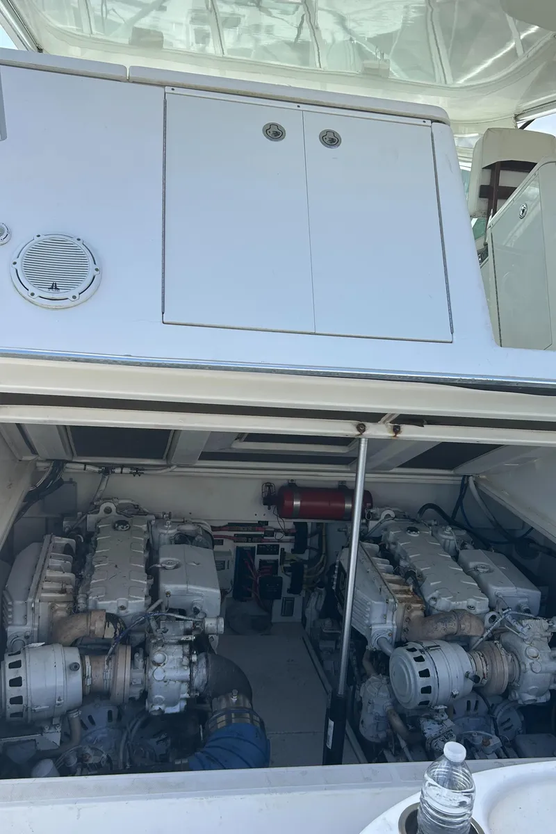 Slide: The Image of Engine compartment of a 2006 Rampage EXPRESS boat, showcasing dual engines and mechanical components. - 28