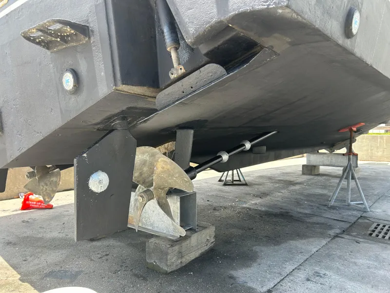 Slide: The Image of 2006 Rampage EXPRESS boat propeller and hull on dry dock. - 31