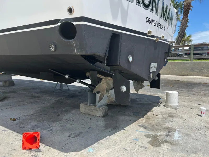 Slide: The Image of 2006 Rampage EXPRESS boat on dry dock, showing propeller and hull details. - 35