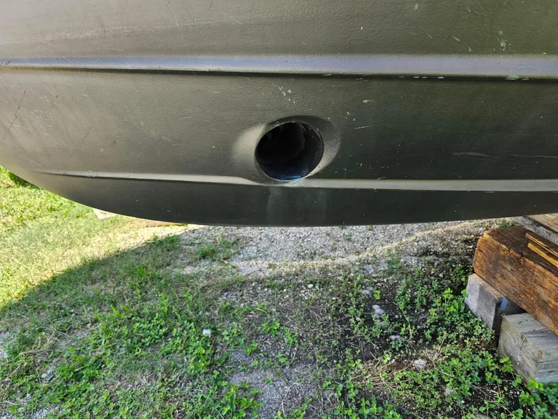 Slide: The Image of Close-up of a 2014 Ranger Tugs 31-CB hull with a drainage hole. - 16