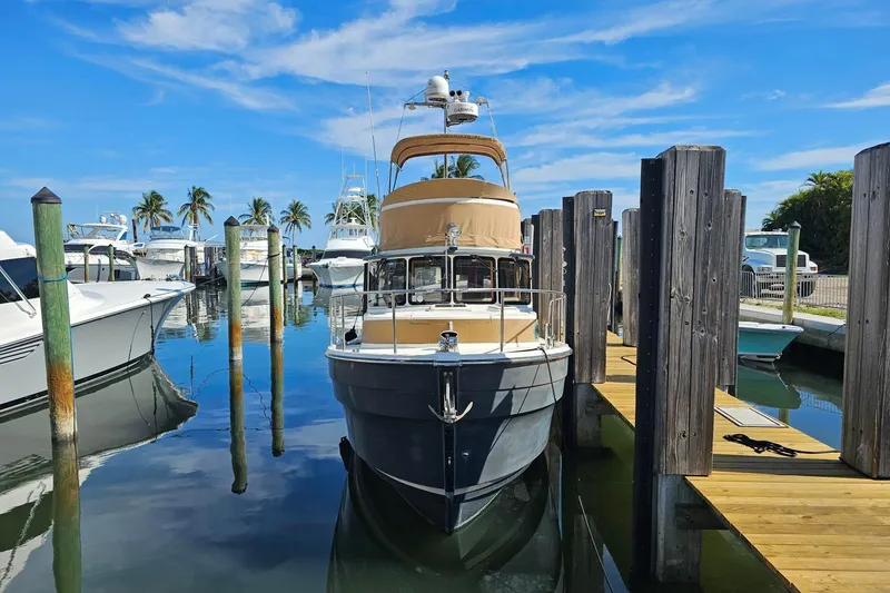 Slide: The Image of 2014 Ranger Tugs R 31 docked at marina with clear blue sky. - 25