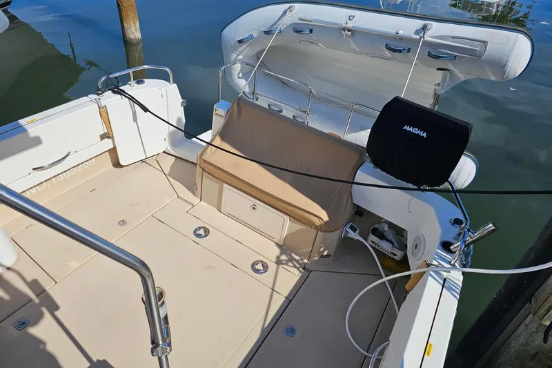 Slide: The Image of 2014 Ranger Tugs R 31 boat deck with seating and Magma grill. - 26