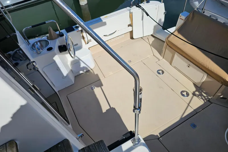 Slide: The Image of 2014 Ranger Tugs R 31 boat cockpit with seating and steering wheel. - 27