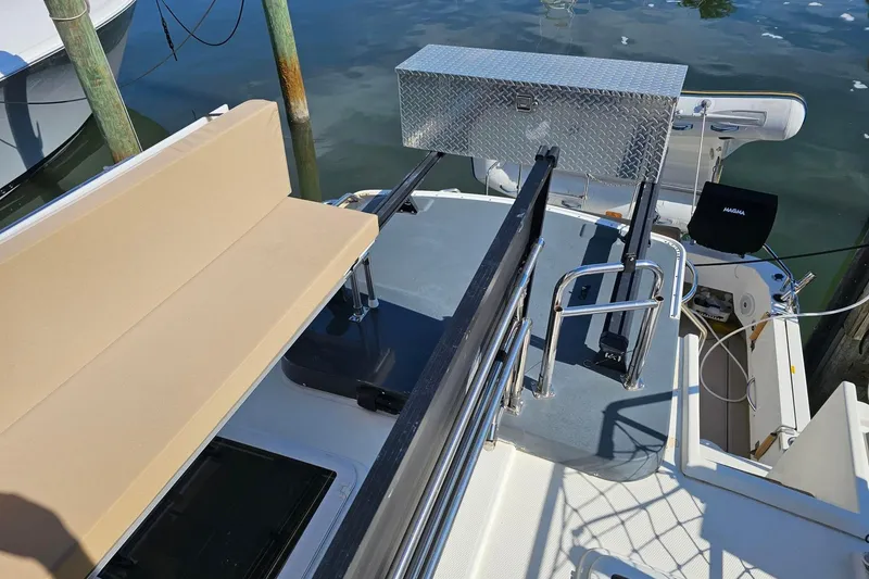 Slide: The Image of 2014 Ranger Tugs R 31 boat deck with seating and storage box. - 30
