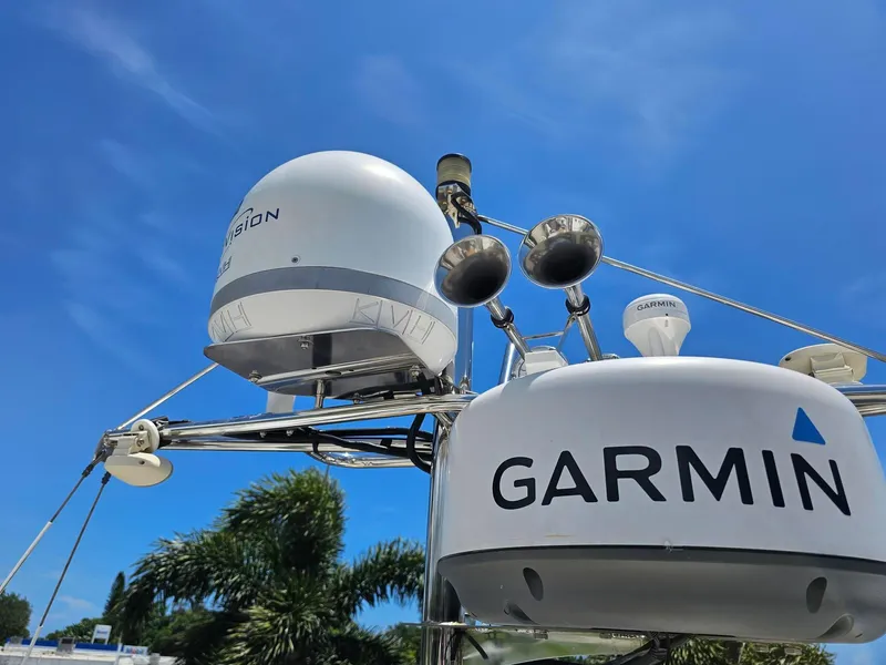Slide: The Image of 2014 Ranger Tugs 31-CB with Garmin and KVH equipment under clear blue sky. - 6