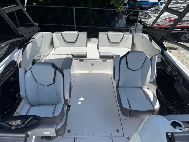 Slide: The Image of 2025 Yamaha Boats AR250 interior with modern seating and sleek design. - 13