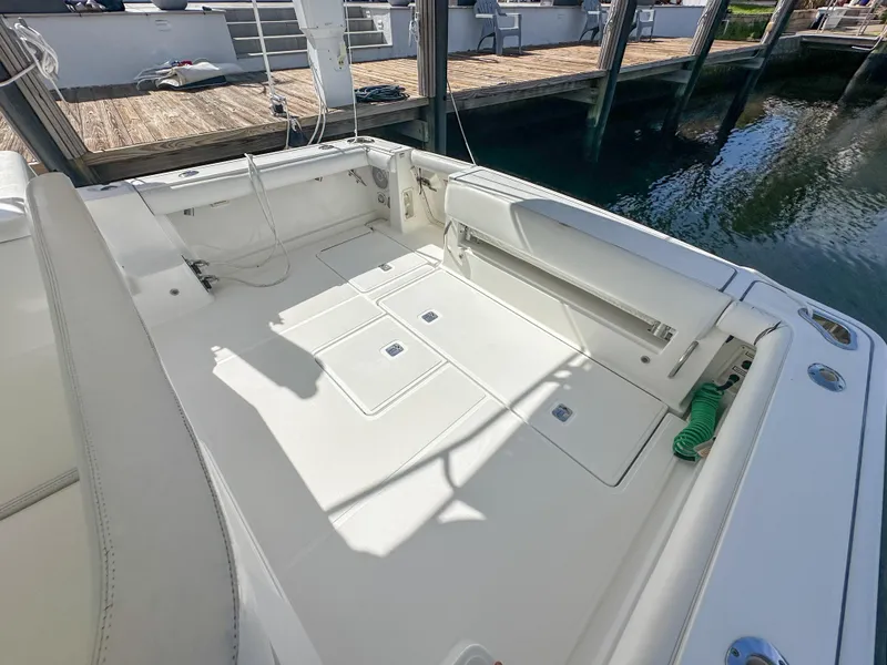 Slide: The Image of 2006 Tiara Yachts 3200 Open boat deck with seating and storage. - 13