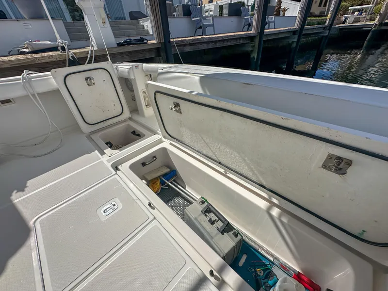 Slide: The Image of 2006 Tiara Yachts 3200 Open deck with storage compartments open. - 14