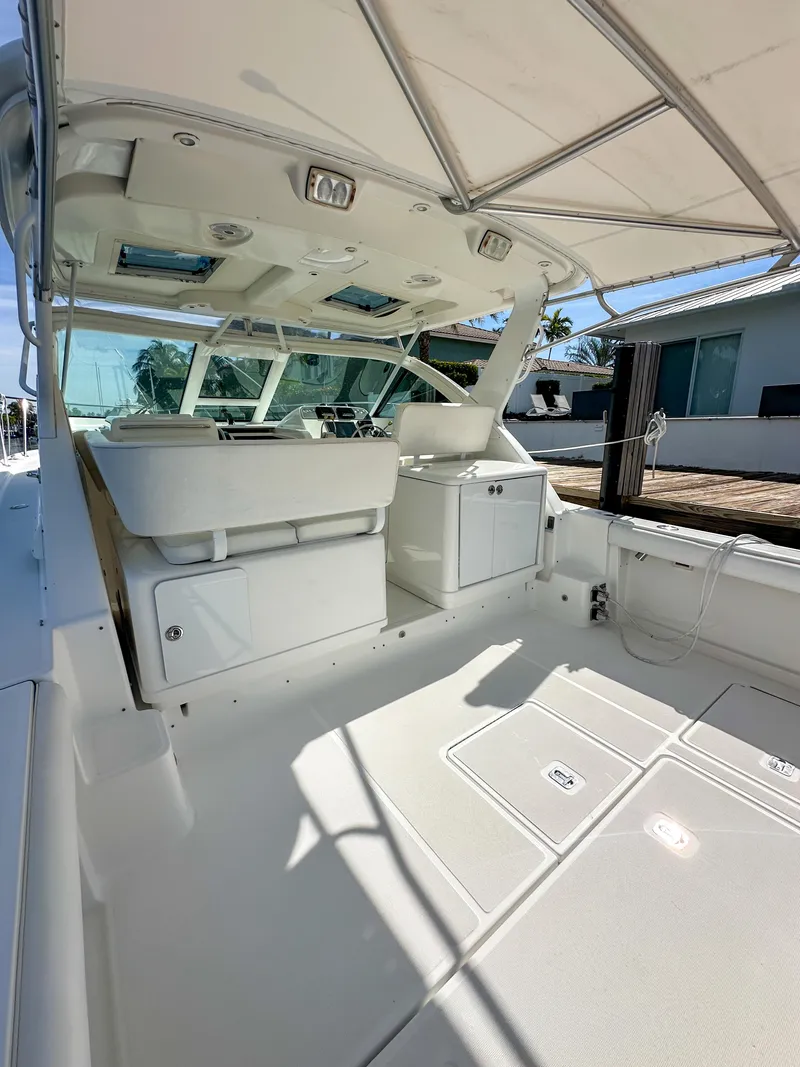 Slide: The Image of 2006 Tiara Yachts 3200 Open boat interior with seating and helm, showcasing luxury design. - 17
