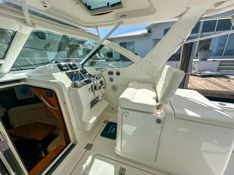 Slide: The Image of 2006 Tiara Yachts 3200 Open cockpit with helm and seating area. - 29