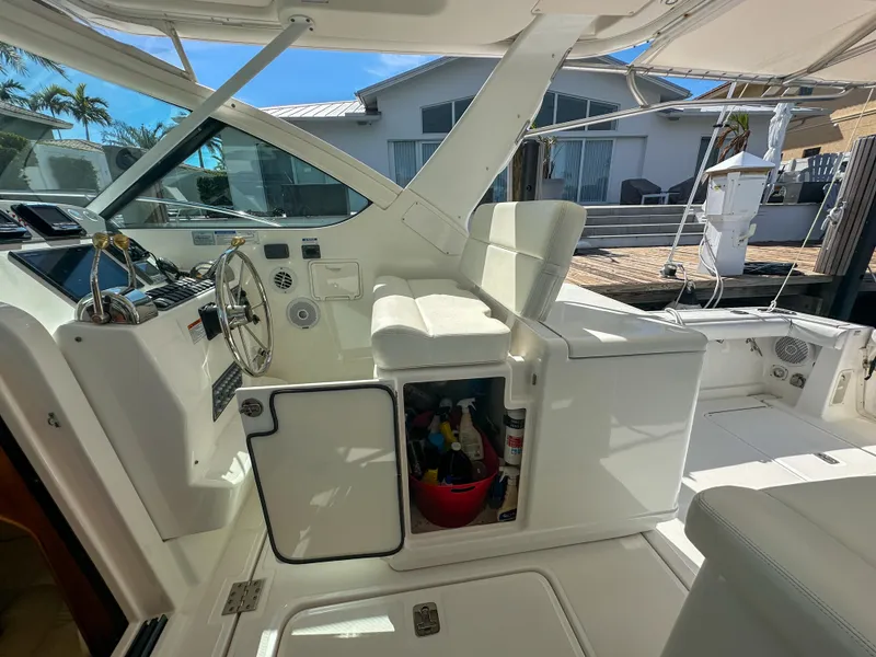Slide: The Image of 2006 Tiara Yachts 3200 Open cockpit with steering wheel and storage compartment. - 30