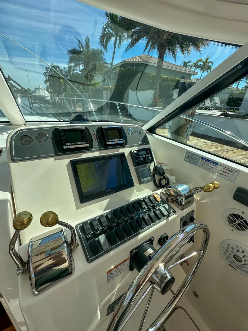 Slide: The Image of 2006 Tiara Yachts 3200 Open helm with modern navigation equipment and controls. - 32