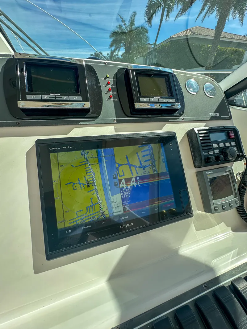 Slide: The Image of Control panel of a 2006 Tiara Yachts 3200 Open with navigation screens. - 33