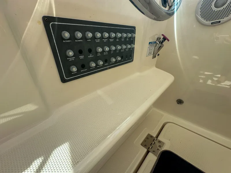 Slide: The Image of Control panel on 2006 Tiara Yachts 3200 Open, featuring multiple switches and speaker. - 35