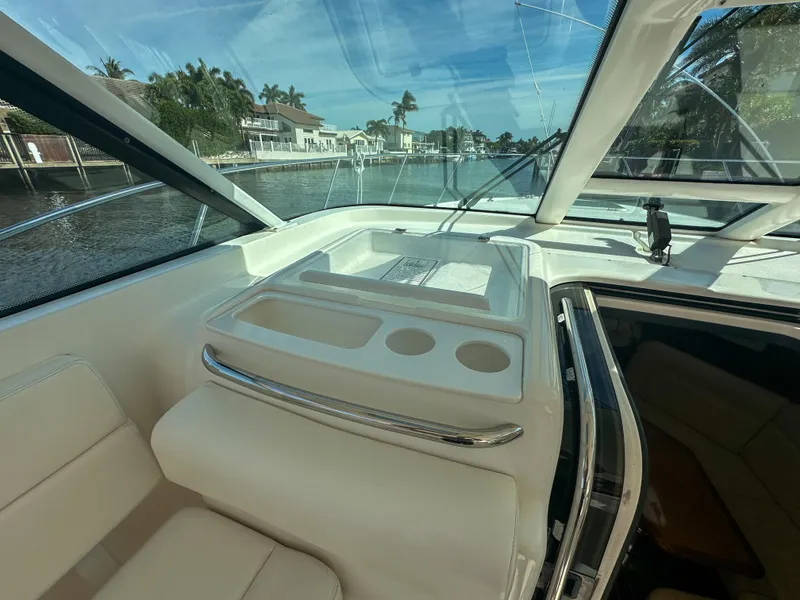 Slide: The Image of 2006 Tiara Yachts 3200 Open interior with seating and waterfront view. - 39