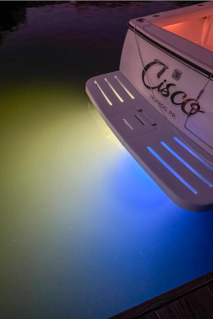 Slide: The Image of 2006 Tiara Yachts 3200 Open with underwater lights illuminating water. - 4