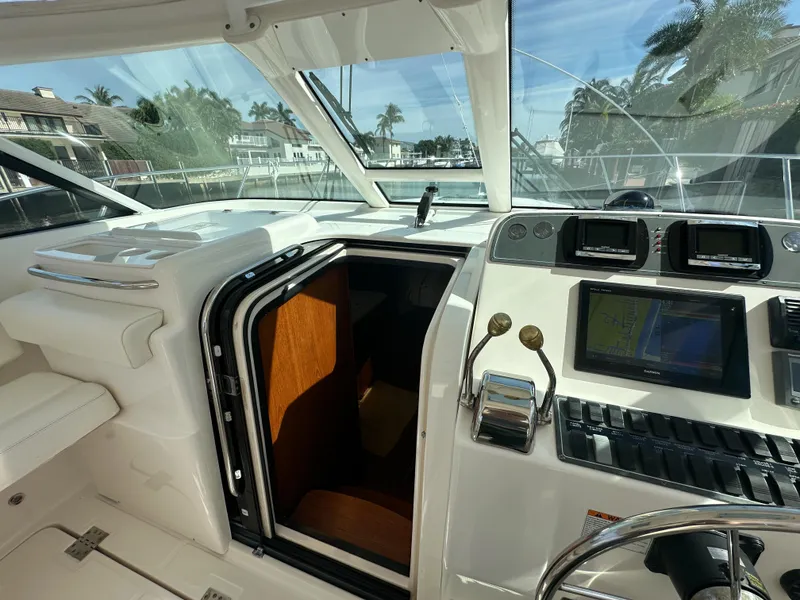 Slide: The Image of 2006 Tiara Yachts 3200 Open helm with navigation equipment and cabin entrance. - 41