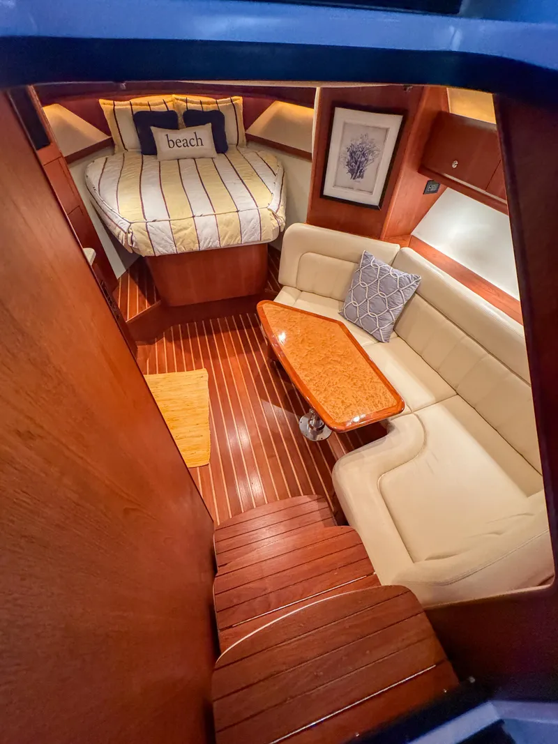 Slide: The Image of Luxurious 2006 Tiara Yachts 3200 Open cabin with cozy seating and elegant wood finishes. - 42