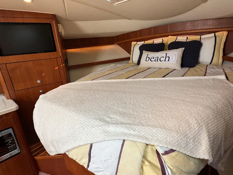 Slide: The Image of 2006 Tiara Yachts 3200 Open cabin with cozy bed and TV. - 48