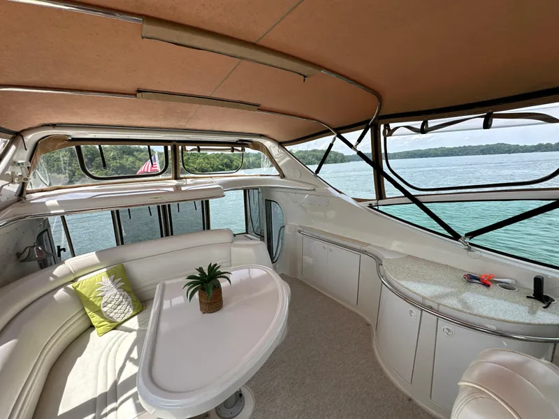 Slide: The Image of Luxurious interior of 2002 Carver 466 Motor Yacht with scenic water view. - 12
