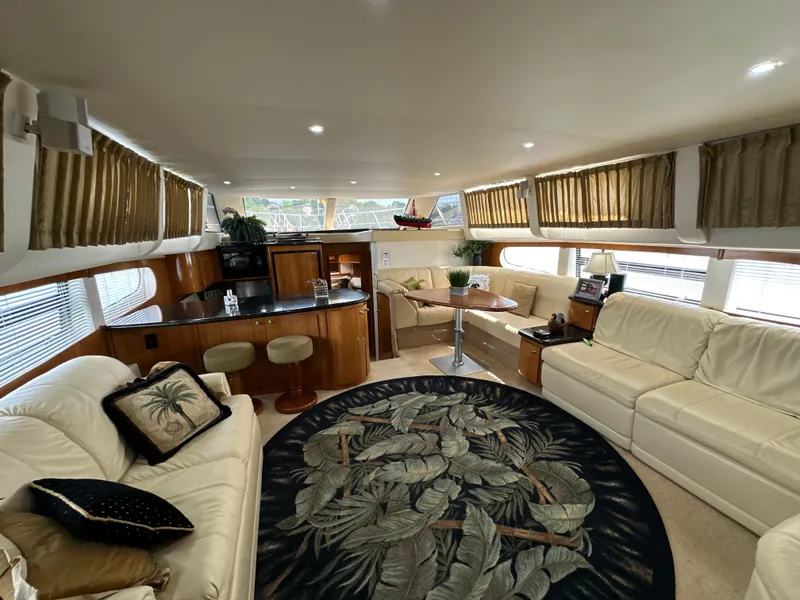 Slide: The Image of Luxurious interior of 2002 Carver 466 Motor Yacht with elegant seating and decor. - 15
