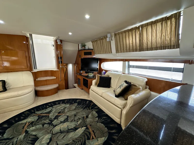 Slide: The Image of Luxurious interior of 2002 Carver 466 Motor Yacht with plush seating and elegant decor. - 17