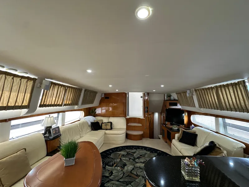 Slide: The Image of Luxurious interior of 2002 Carver 466 Motor Yacht with elegant seating and decor. - 19