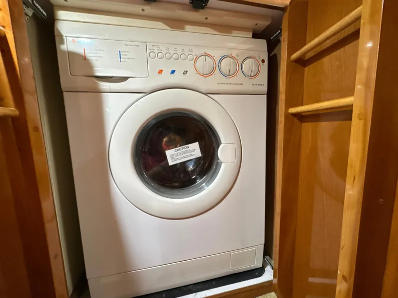 Slide: The Image of Washing machine inside a 2002 Carver 466 Motor Yacht wooden cabinet. - 27