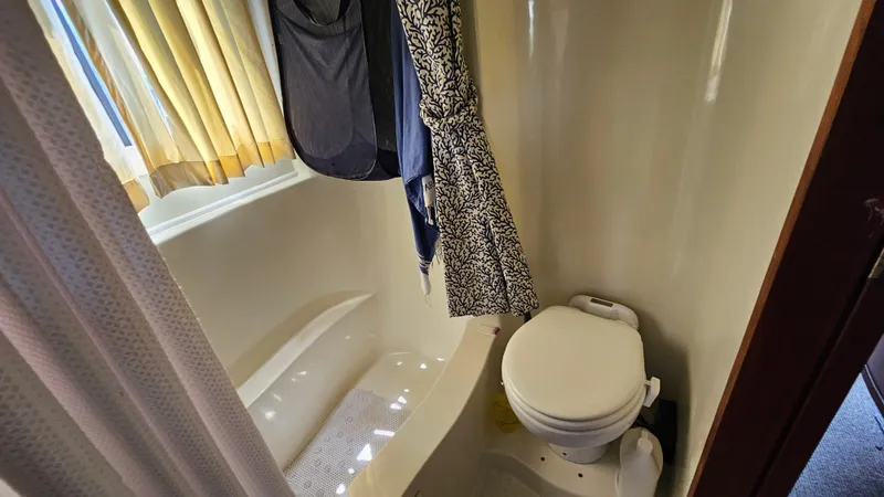 Slide: The Image of Bathroom interior of 1988 Bluewater Yachts 55 Coastal Cruiser with shower and toilet. - 26