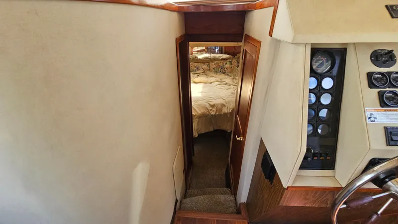 Slide: The Image of Interior view of 1988 Bluewater Yachts 55 Coastal Cruiser, showing cabin and control panel. - 29