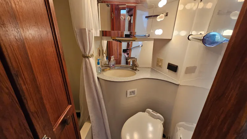 Slide: The Image of Bathroom interior of 1988 Bluewater Yachts 55 Coastal Cruiser, featuring sink and toilet. - 31