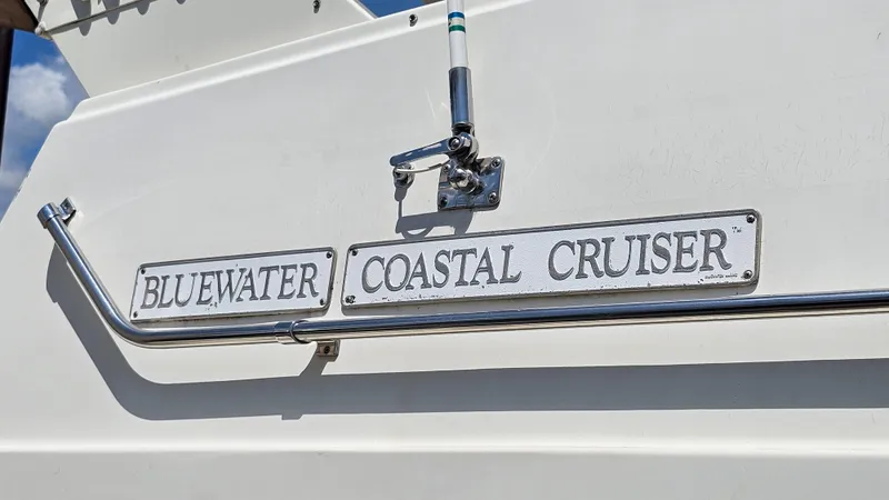 Slide: The Image of 1988 Bluewater Yachts 55 Coastal Cruiser nameplate on boat exterior. - 38
