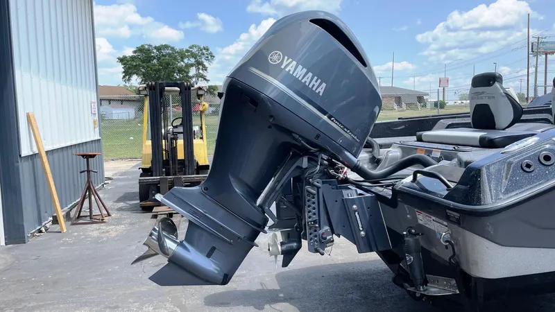 Slide: The Image of 2025 Skeeter WXR 2060 boat with Yamaha outboard motor in a sunny outdoor setting. - 3