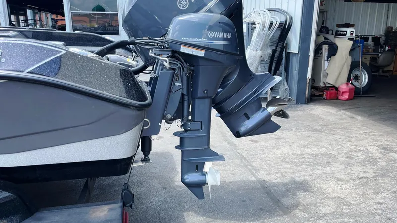 Slide: The Image of 2025 Skeeter WXR 2060 boat with Yamaha outboard motor in a garage setting. - 4