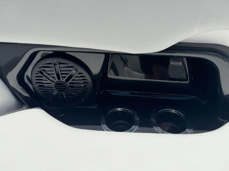 Slide: The Image of 2025 Yamaha AR250 boat interior with speaker and cup holders. - 10