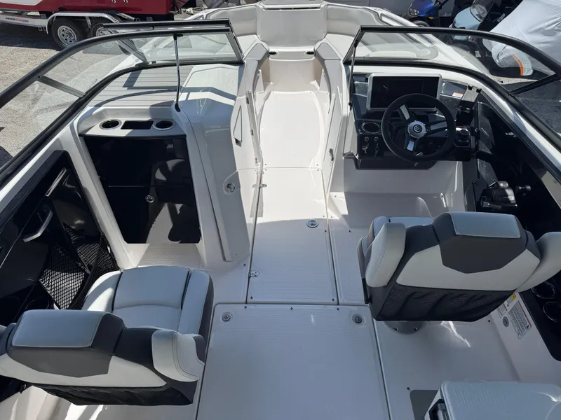 Slide: The Image of 2025 Yamaha Boats AR250 interior with modern seating and sleek dashboard design. - 4
