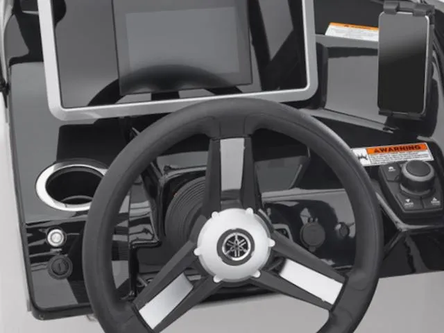 Slide: The Image of 2025 Yamaha AR250 boat dashboard with steering wheel and digital display. - 41