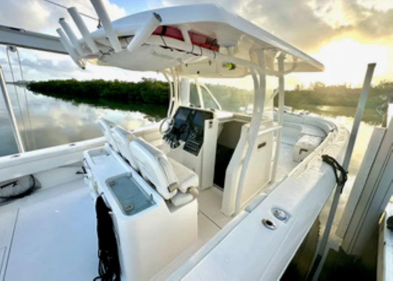 Slide: The Image of 2017 Stamas 390 Tarpon boat at sunrise, featuring spacious deck and seating. - 14