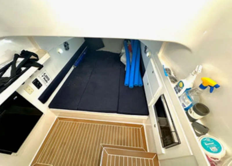 Slide: The Image of Interior cabin of 2017 Stamas 390 Tarpon boat with storage and cleaning supplies. - 20