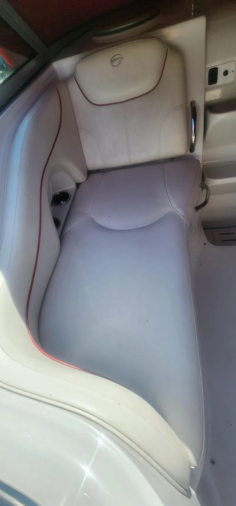 Slide: The Image of 2009 Crownline 250cr boat interior with white leather seating. - 10