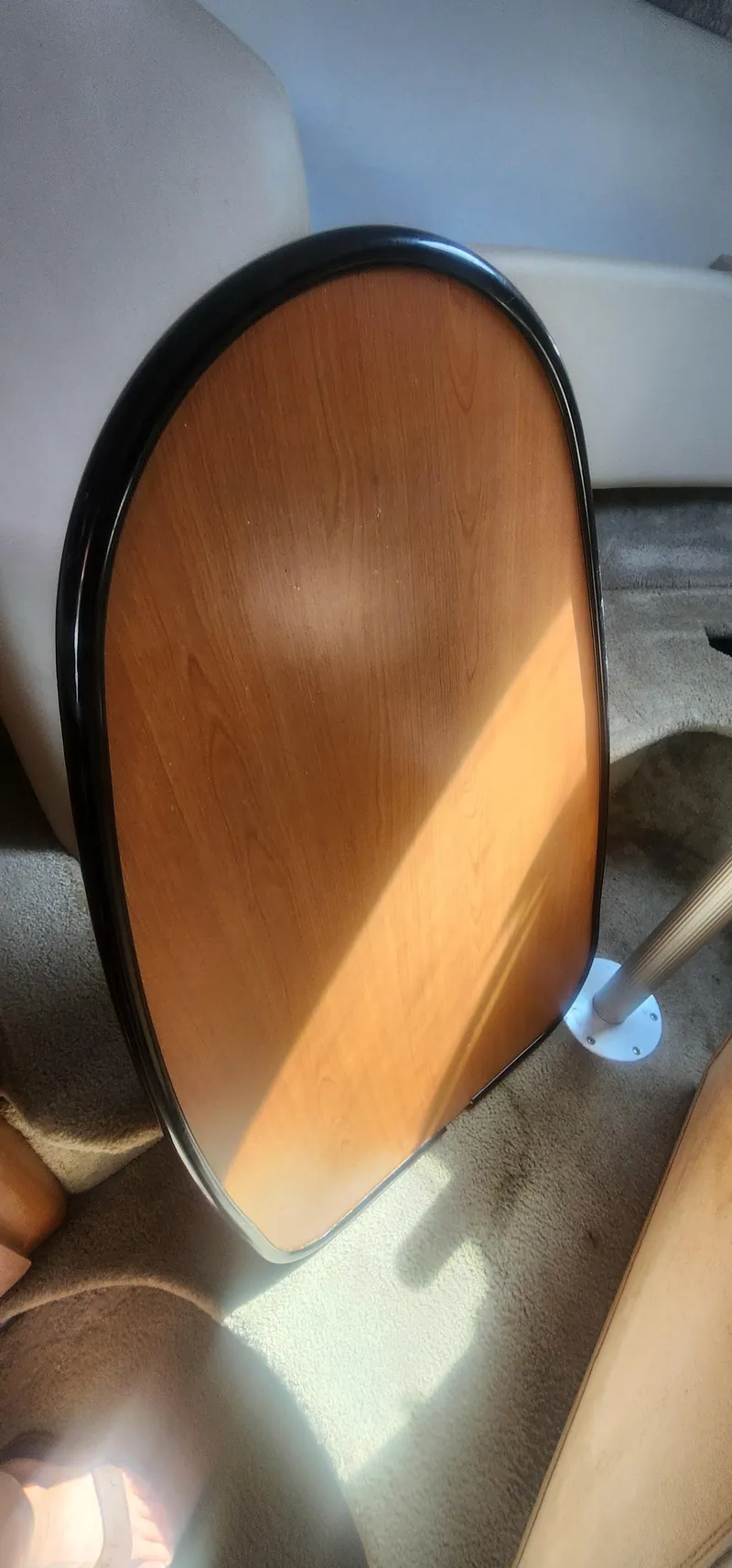 Slide: The Image of Wooden table inside 2009 Crownline 250cr boat, sunlight casting shadows. - 23