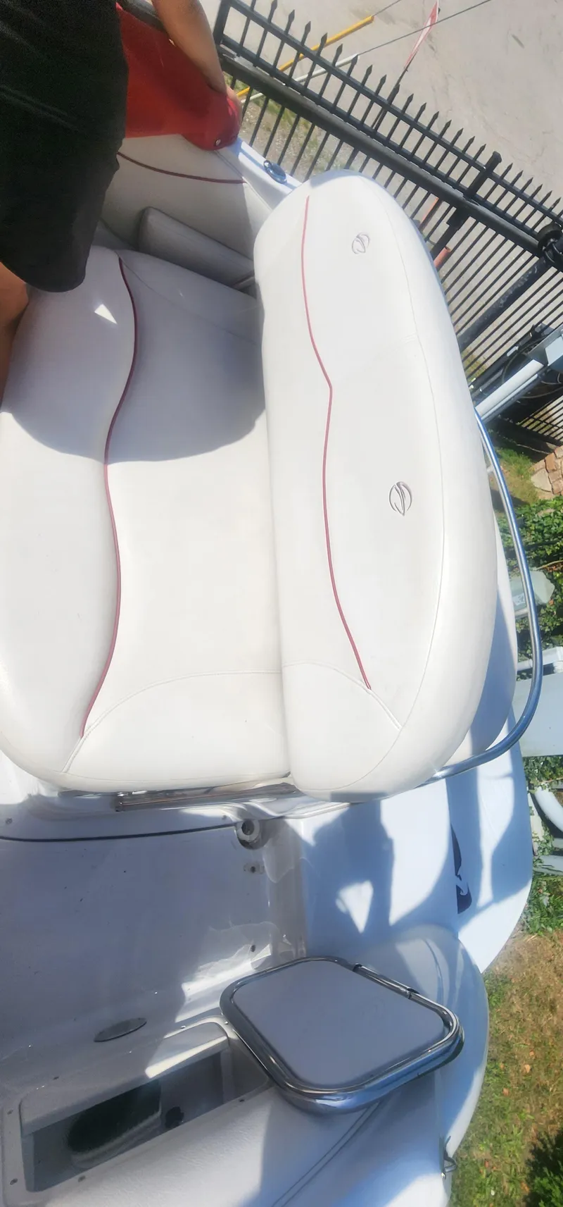 Slide: The Image of 2009 Crownline 250cr boat with white seating and red accents. - 9