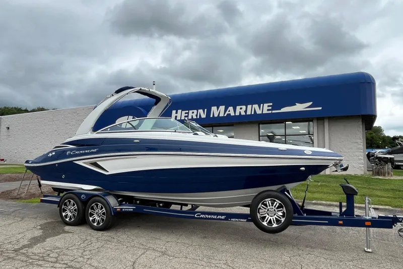 The Image of 2026 Crownline 270 SS boat on trailer outside Hern Marine dealership. - 0