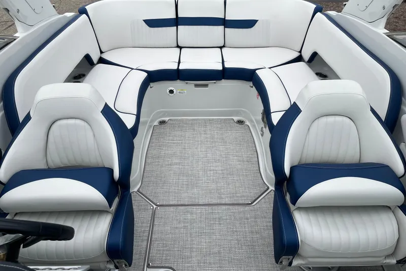 Slide: The Image of 2026 Crownline 270 SS boat interior with white and blue seating arrangement. - 10